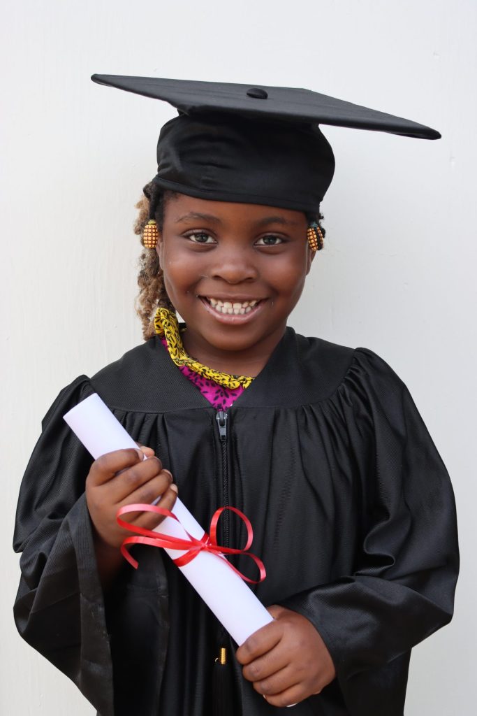 smiling girl holding diploma